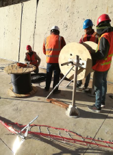 On-site installation inside dam structure