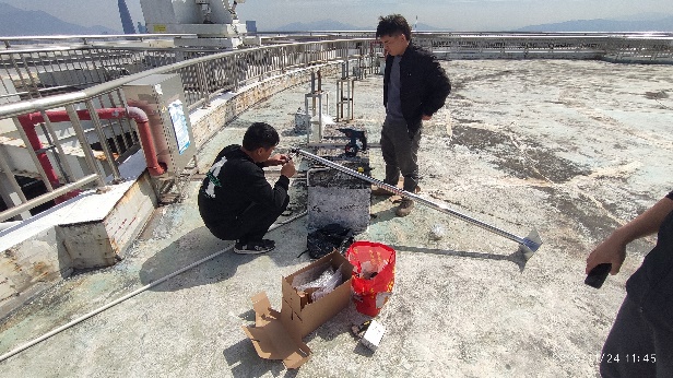SEG Plaza rooftop sensor installation for high-rise vibration and wind monitoring